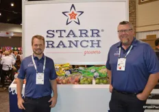 Brent Shammo and Dan Davis with Starr Ranch Growers proudly stand in front of the company’s organic apple display.